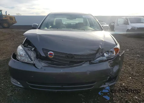 2003 Toyota Camry Le z USA, uszkodzony, nr VIN 4T1BE30K73U758570